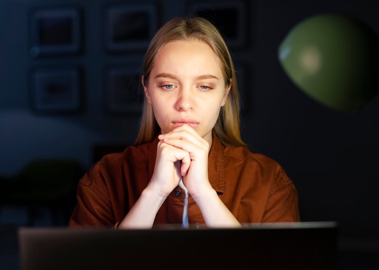 A person in deep thought, representing questions about meditation and design courses